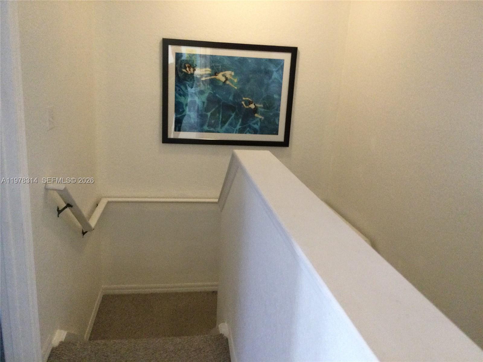 4601 Yellowgold Road West, Unit B8104 Kissimmee, FL 34746 - Photo 11 of 16 a view of a small room with wooden floor