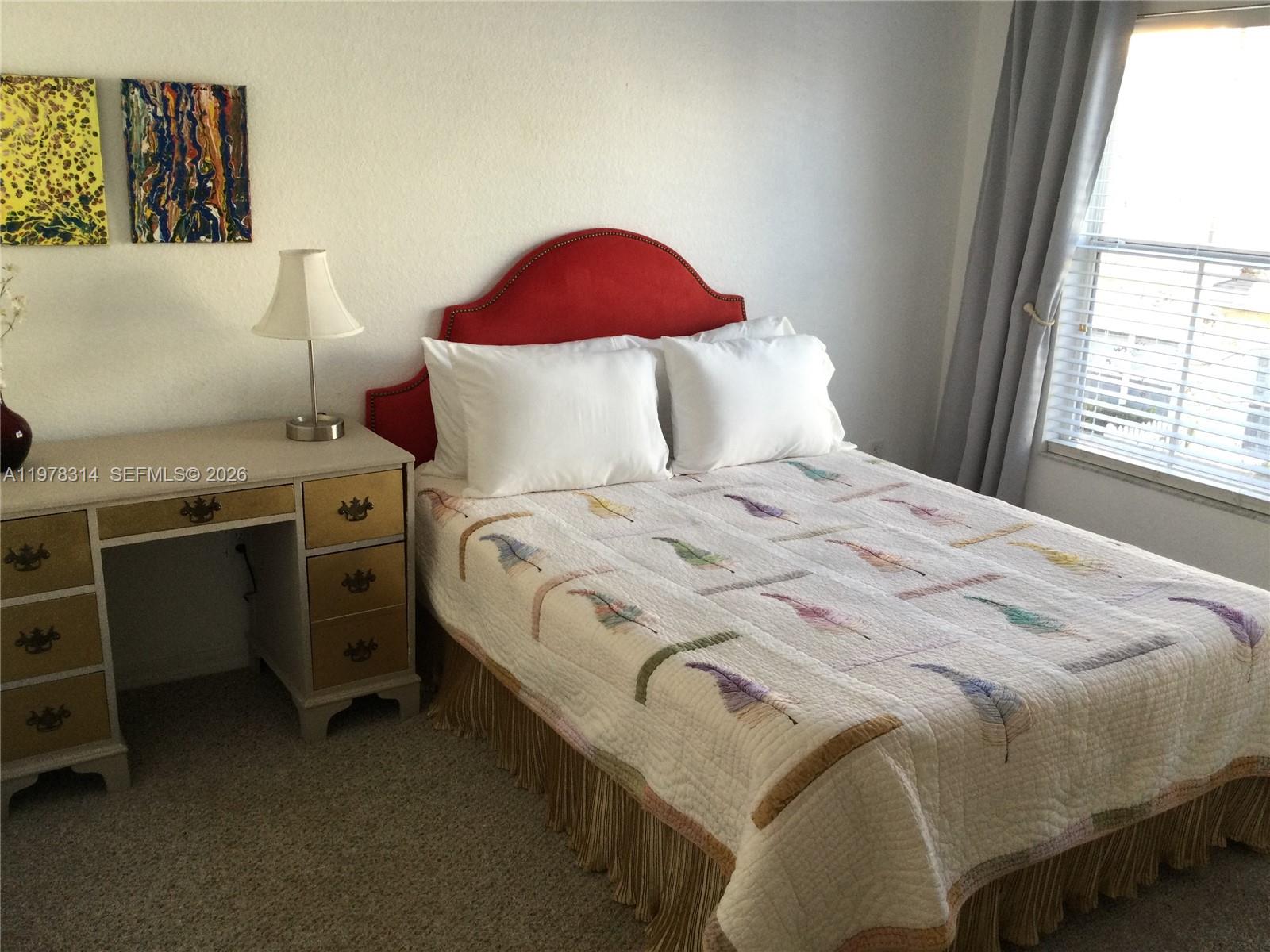 4601 Yellowgold Road West, Unit B8104 Kissimmee, FL 34746 - Photo 14 of 16 a bedroom with a bed and a window