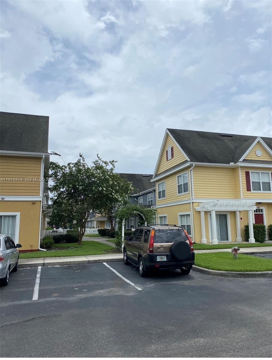 4601 Yellowgold Road West, Unit B8104 Kissimmee, FL 34746 - Photo 16 of 16 a car parked in front of a house