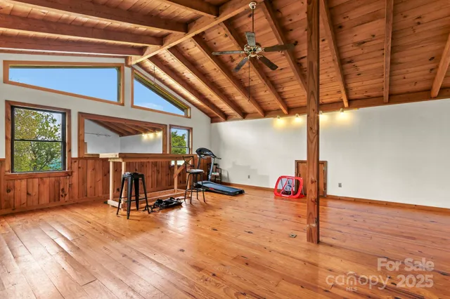 a view of a patio with table and chairs