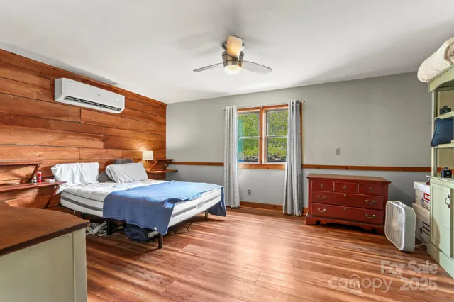 a bedroom with furniture and a window