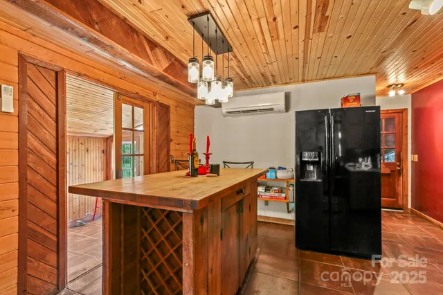 a kitchen with stainless steel appliances a refrigerator and a stove