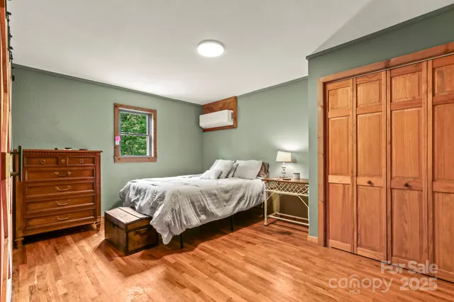 a bed room with a bed and a window