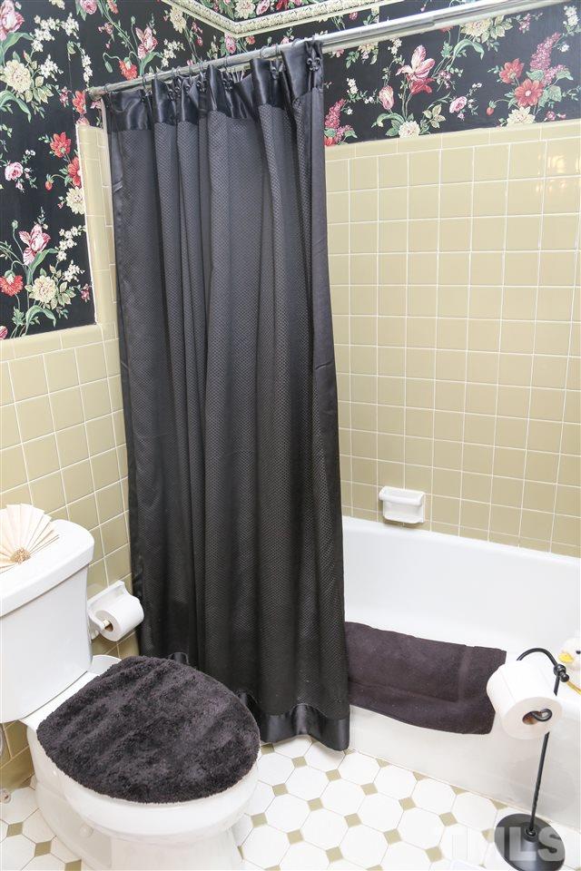 4800 Poland Place Raleigh, NC 27609 - Photo 22 of 30 a bathroom with a bathtub and shower