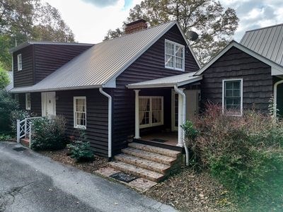 1837 Deep South Farm Road Blairsville, GA 30512 - Photo 26 of 76 a front view of a house with garden