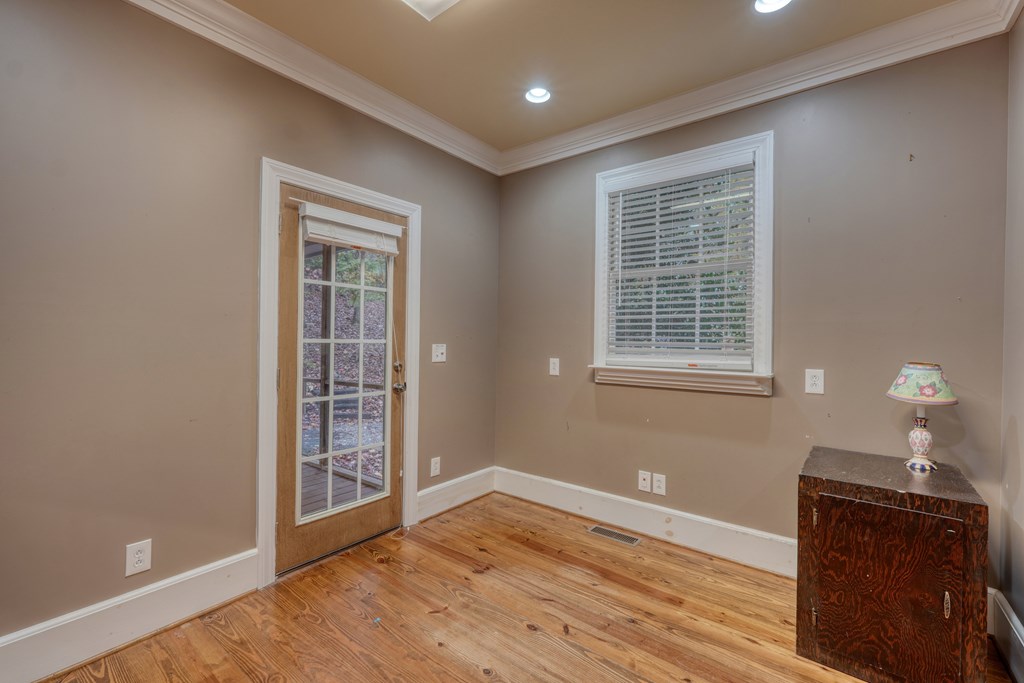 1837 Deep South Farm Road Blairsville, GA 30512 - Photo 35 of 76 a view of an empty room with wooden floor and a window