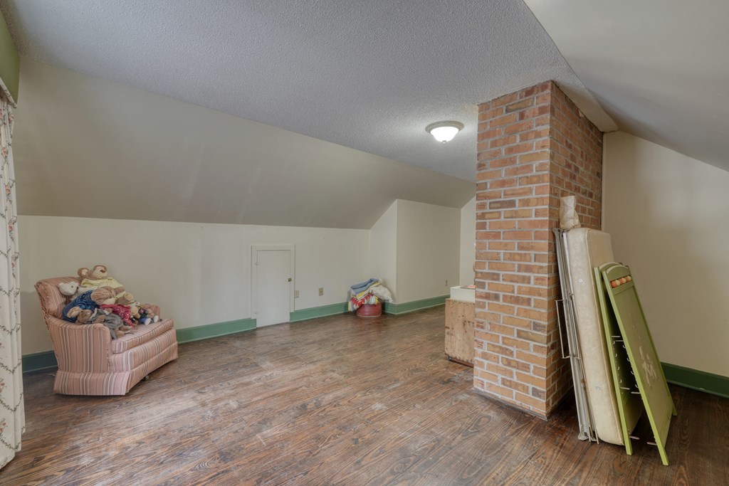 1837 Deep South Farm Road Blairsville, GA 30512 - Photo 50 of 76 a view of room with stairs and couch