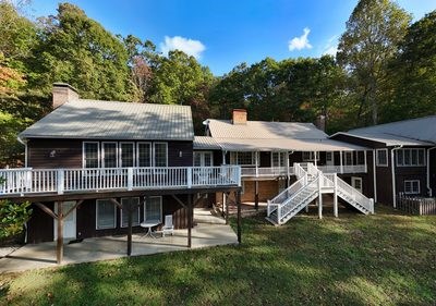 1837 Deep South Farm Road Blairsville, GA 30512 - Photo 5 of 76 a view of a house with a backyard porch and sitting area