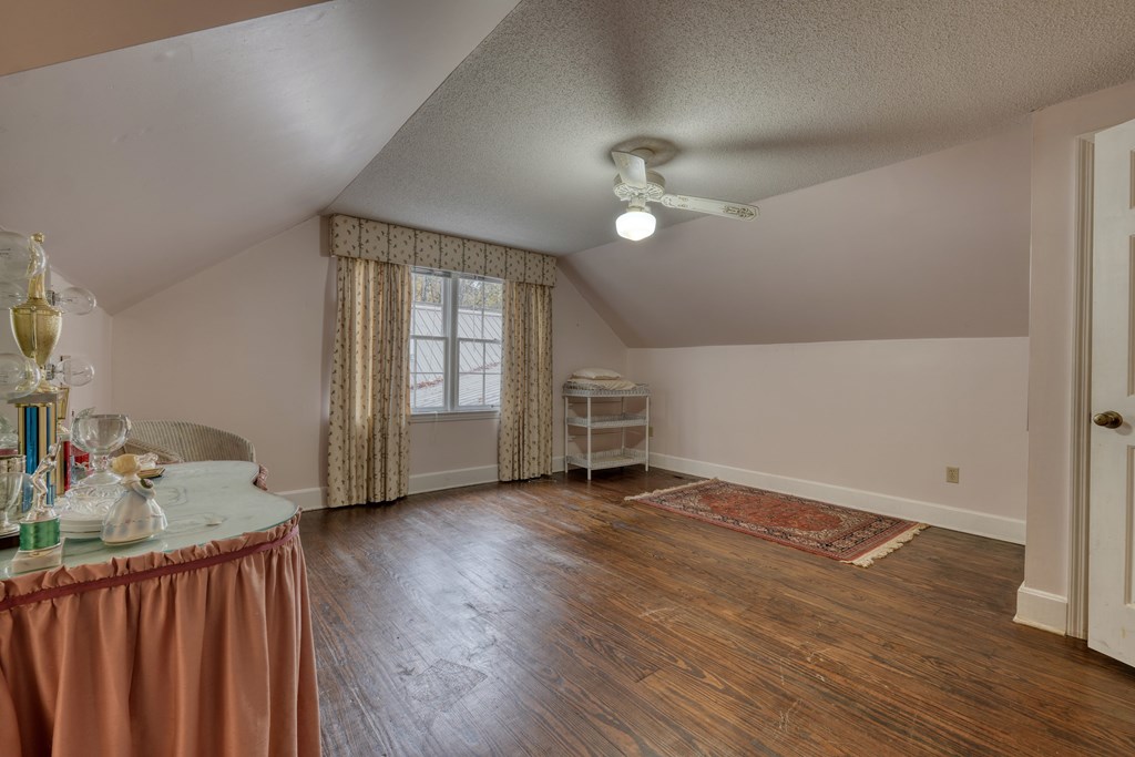 1837 Deep South Farm Road Blairsville, GA 30512 - Photo 54 of 76 wooden floor in an empty room with a window