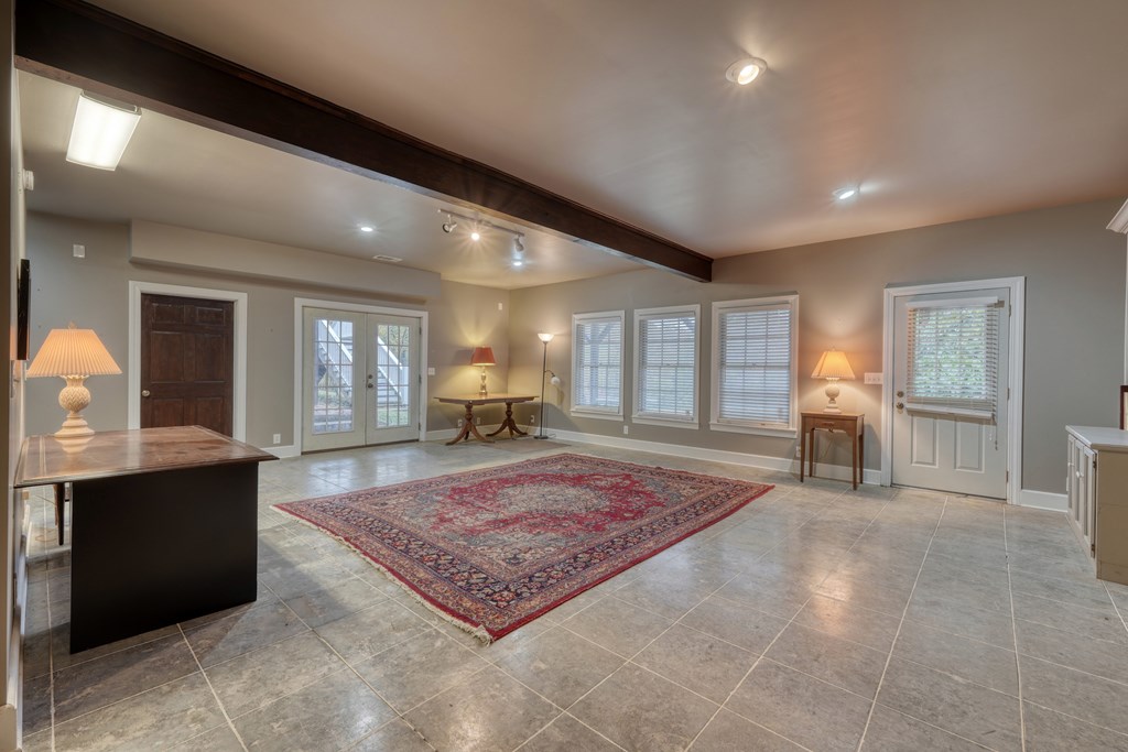 1837 Deep South Farm Road Blairsville, GA 30512 - Photo 56 of 76 a living room with furniture rug and window