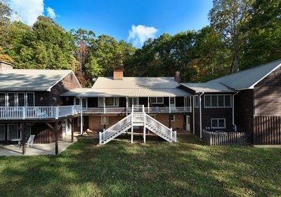 1837 Deep South Farm Road Blairsville, GA 30512 - Photo 6 of 76 a view of a house with a yard balcony and furniture