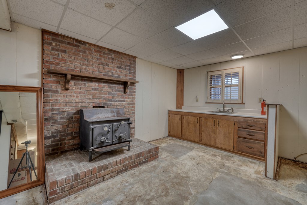 1837 Deep South Farm Road Blairsville, GA 30512 - Photo 61 of 76 a kitchen with furniture and a fireplace