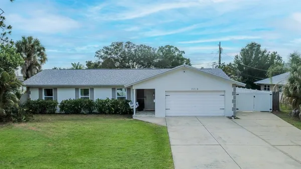 a view of a house with a yard