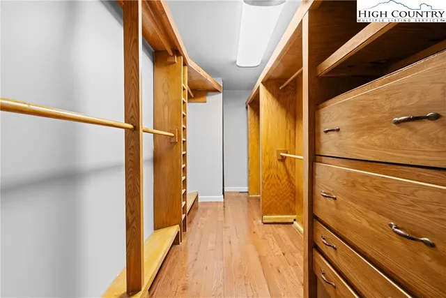 a room with a bed and a mirror