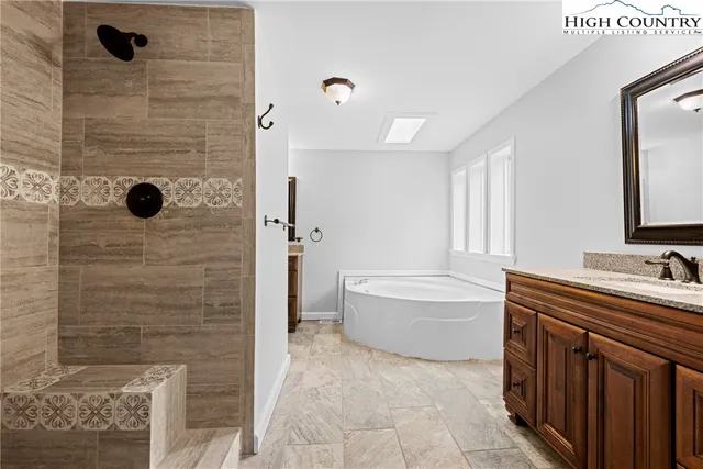 a kitchen with stainless steel appliances granite countertop a sink and cabinets