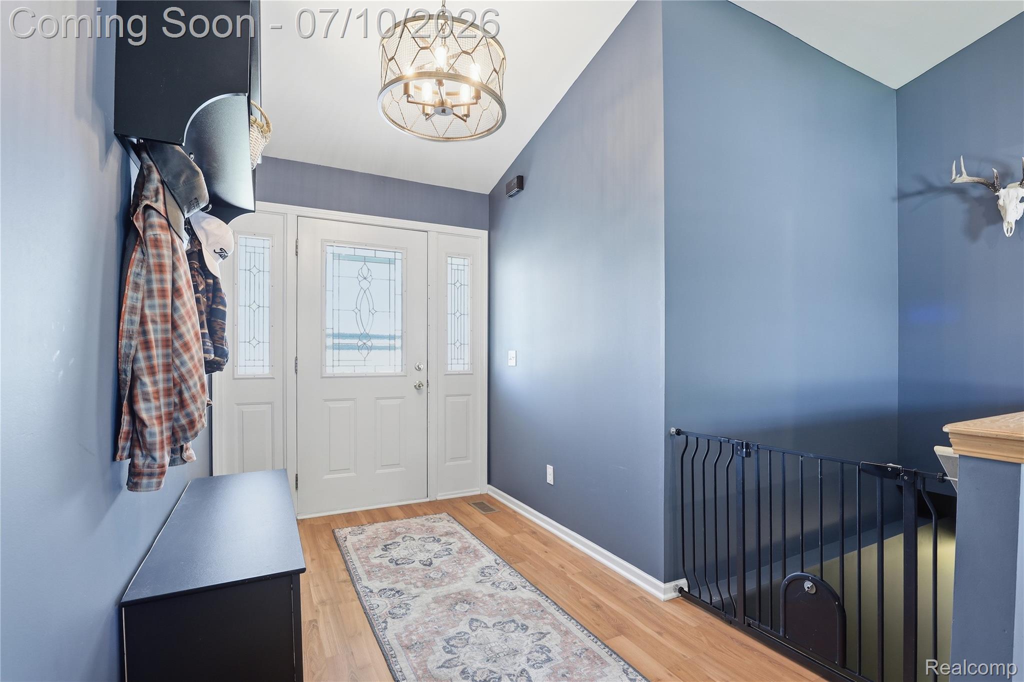 5275 East Maple Avenue Grand Blanc, MI 48439 - Photo 14 of 53 Entryway featuring a white door with decorative glass inserts, flanked by matching sidelights