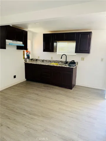 a kitchen with stainless steel appliances kitchen island microwave and cabinets