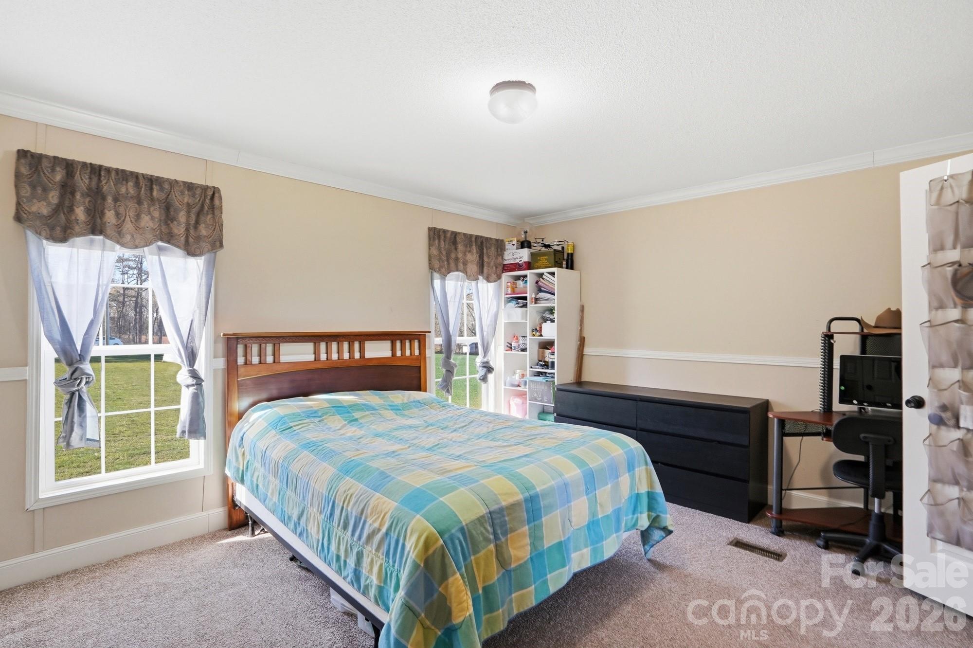 4111 Clontz Taylor Road Marshville, NC 28103 - Photo 14 of 27 a bedroom with a bed and a window
