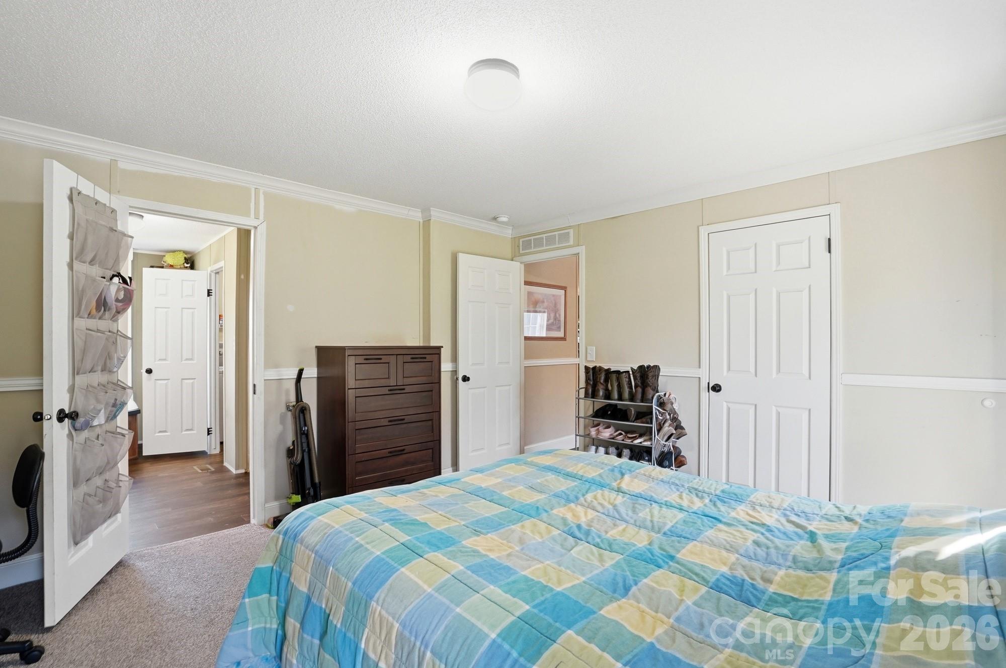 4111 Clontz Taylor Road Marshville, NC 28103 - Photo 15 of 27 a bedroom with a bed and a walk in closet