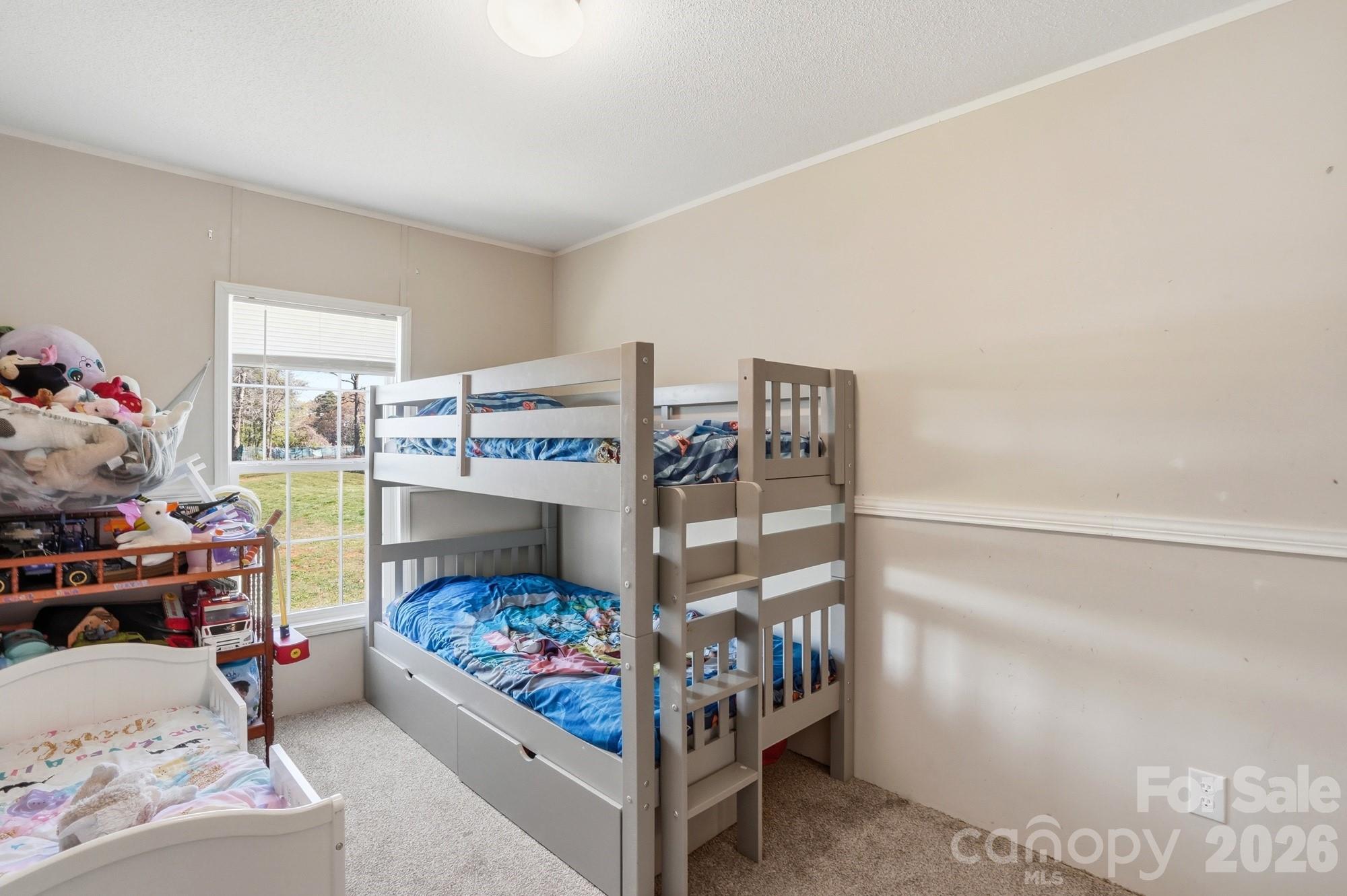 4111 Clontz Taylor Road Marshville, NC 28103 - Photo 19 of 27 a bedroom with a bed and a window