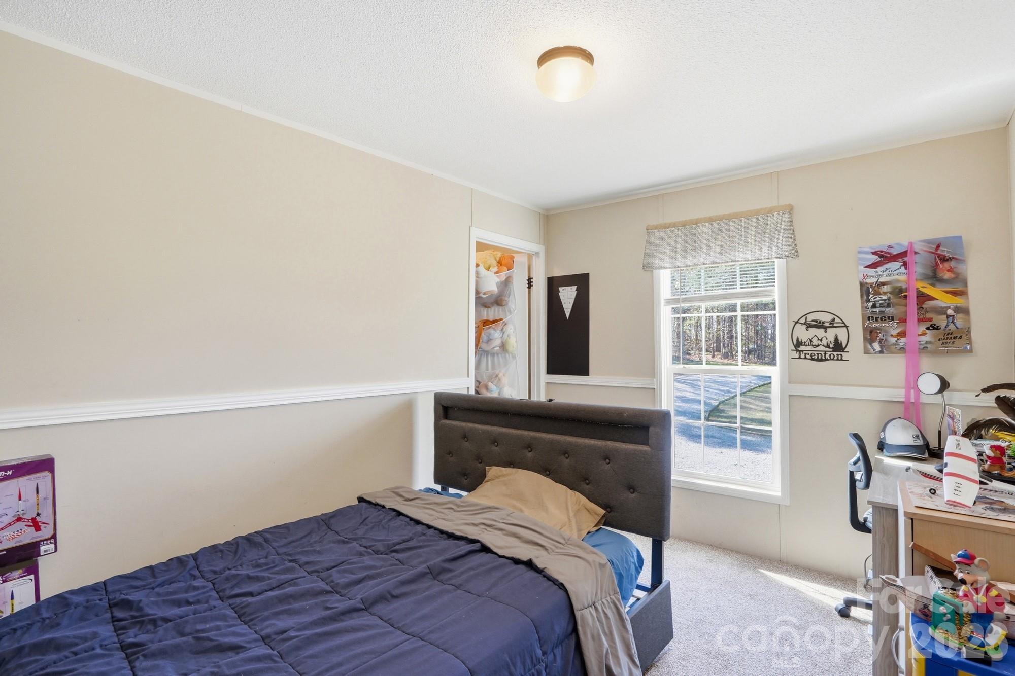4111 Clontz Taylor Road Marshville, NC 28103 - Photo 20 of 27 a bedroom with a bed and a window