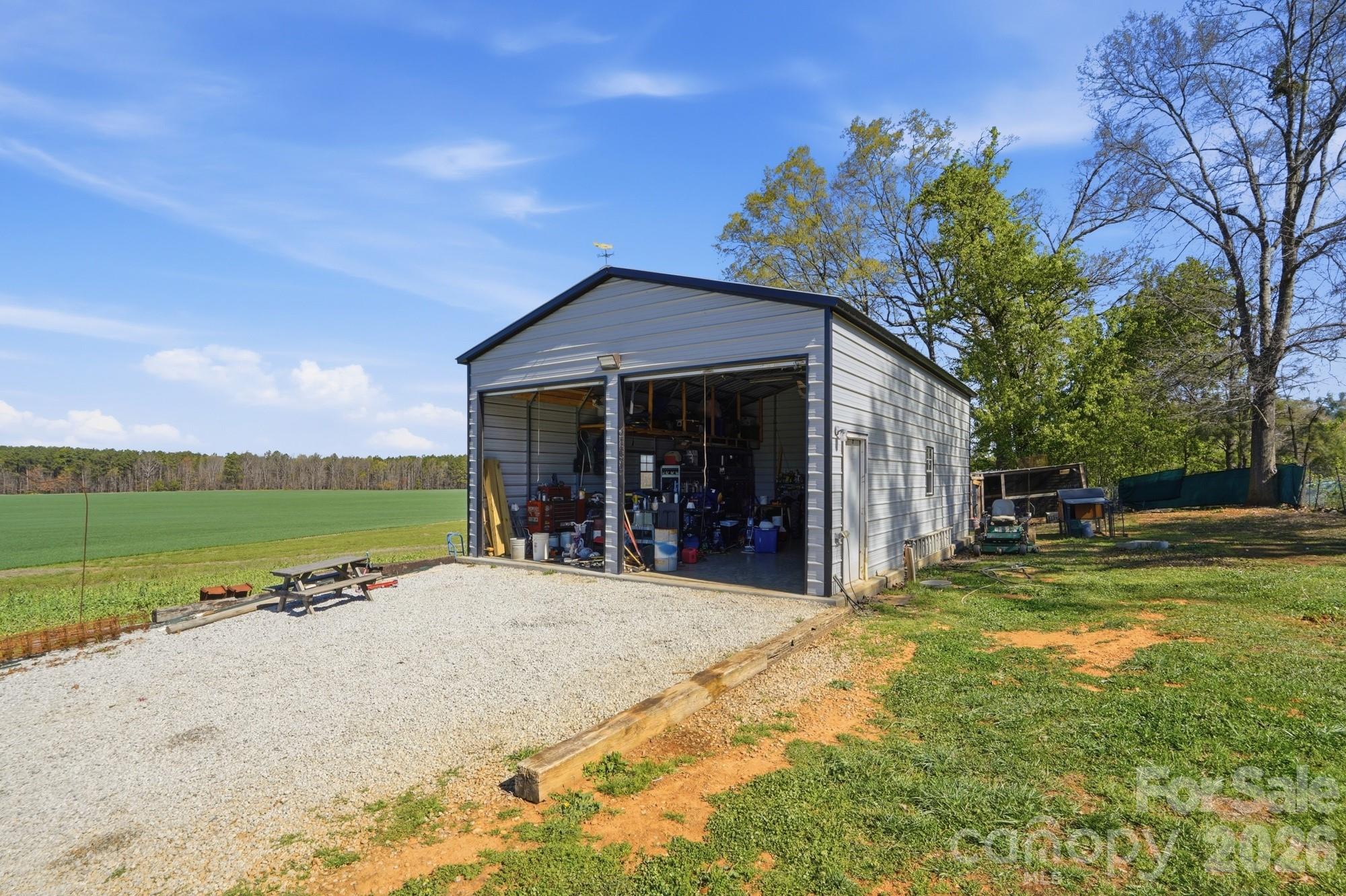 4111 Clontz Taylor Road Marshville, NC 28103 - Photo 25 of 27 a view of a house with a yard and sitting area