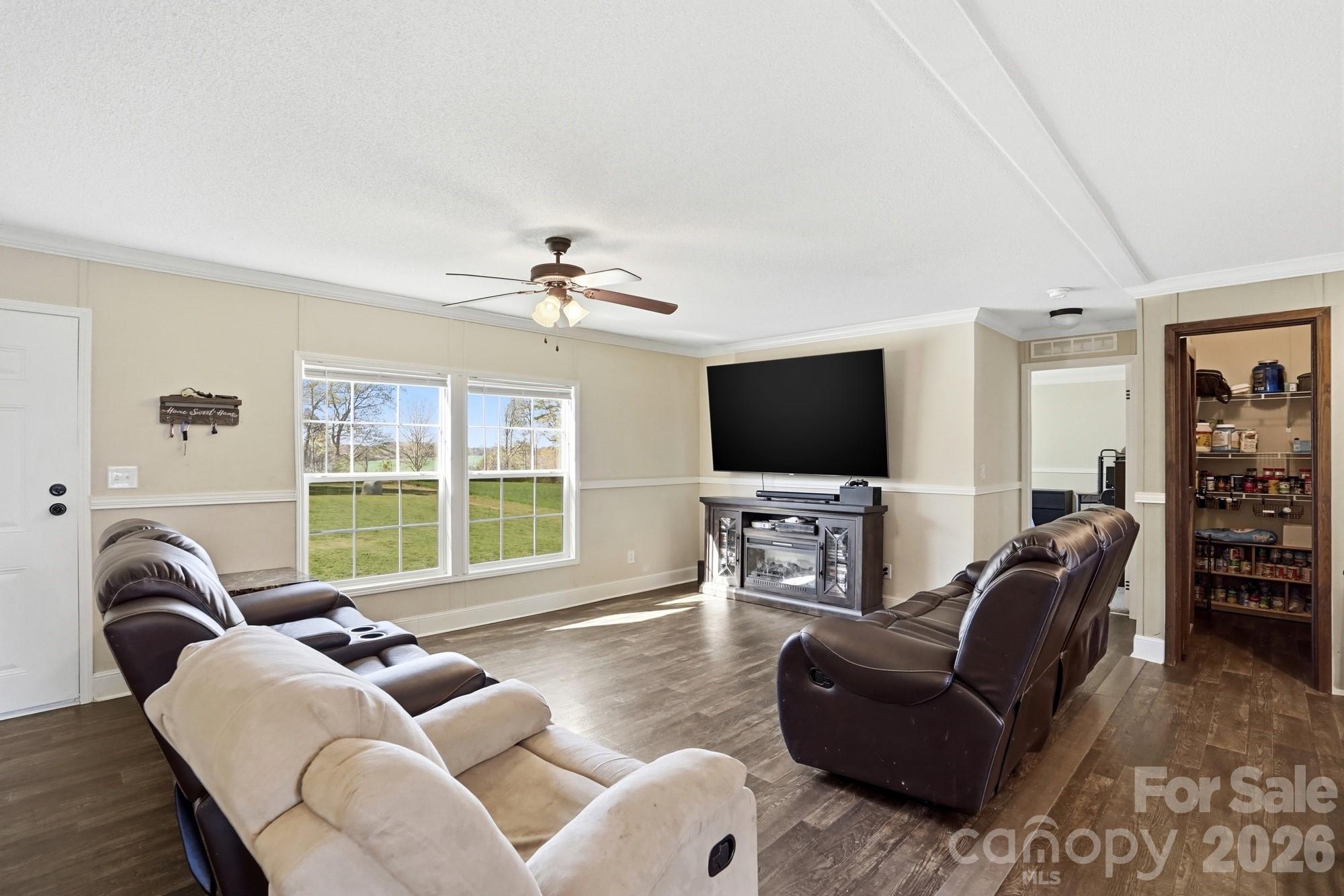 4111 Clontz Taylor Road Marshville, NC 28103 - Photo 4 of 27 a living room with furniture and a flat screen tv