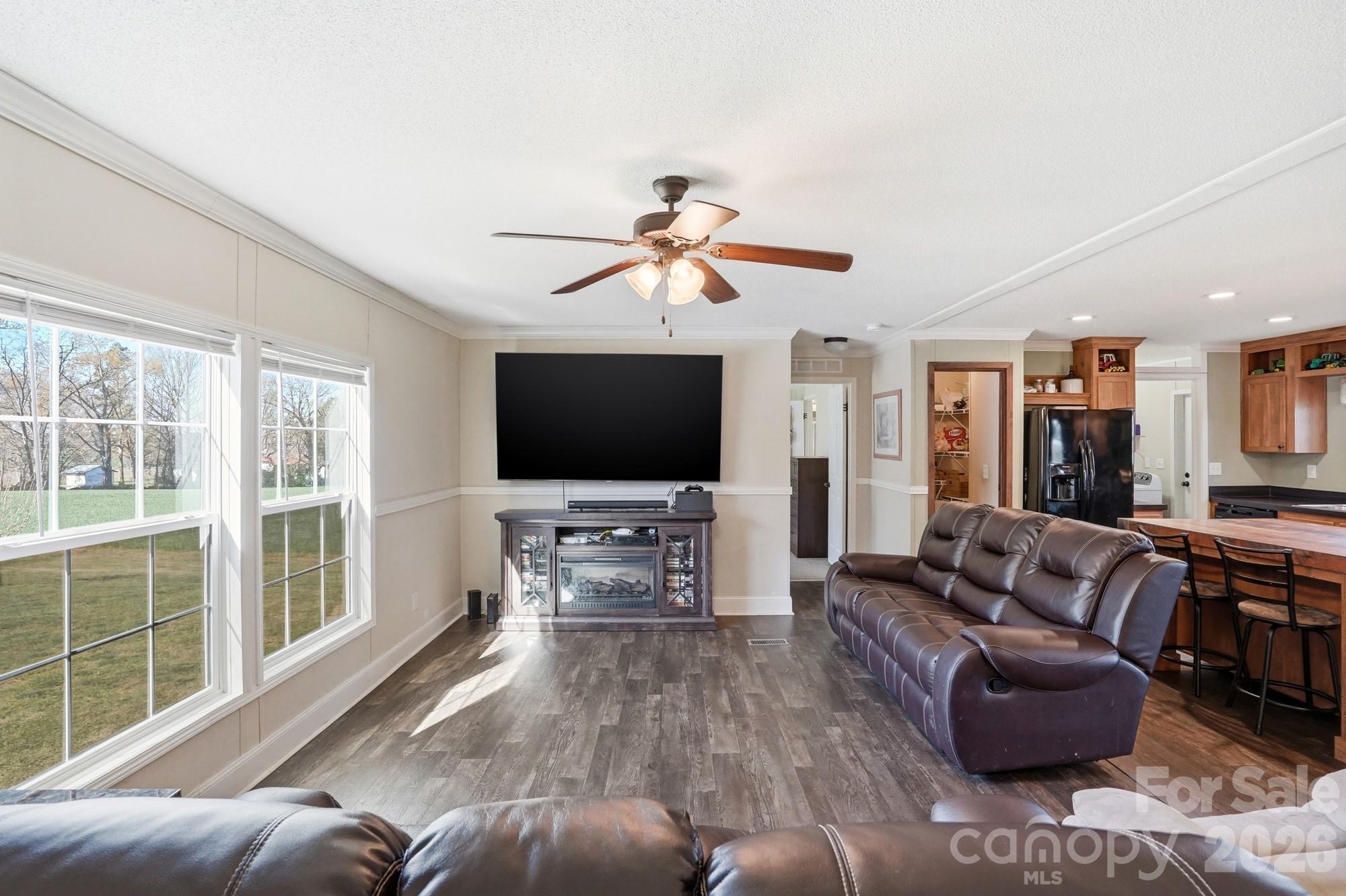 4111 Clontz Taylor Road Marshville, NC 28103 - Photo 5 of 27 a living room with furniture and a flat screen tv
