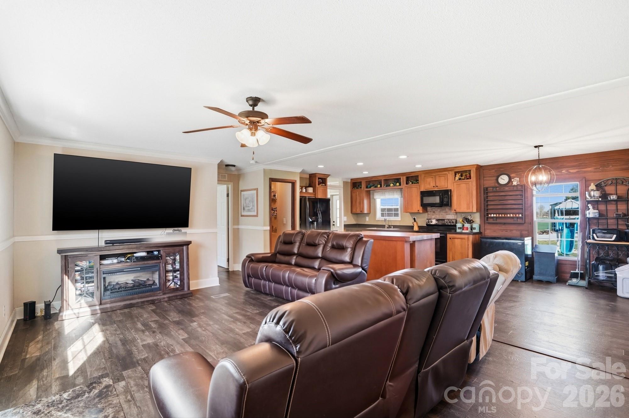 4111 Clontz Taylor Road Marshville, NC 28103 - Photo 6 of 27 a living room with furniture and a flat screen tv
