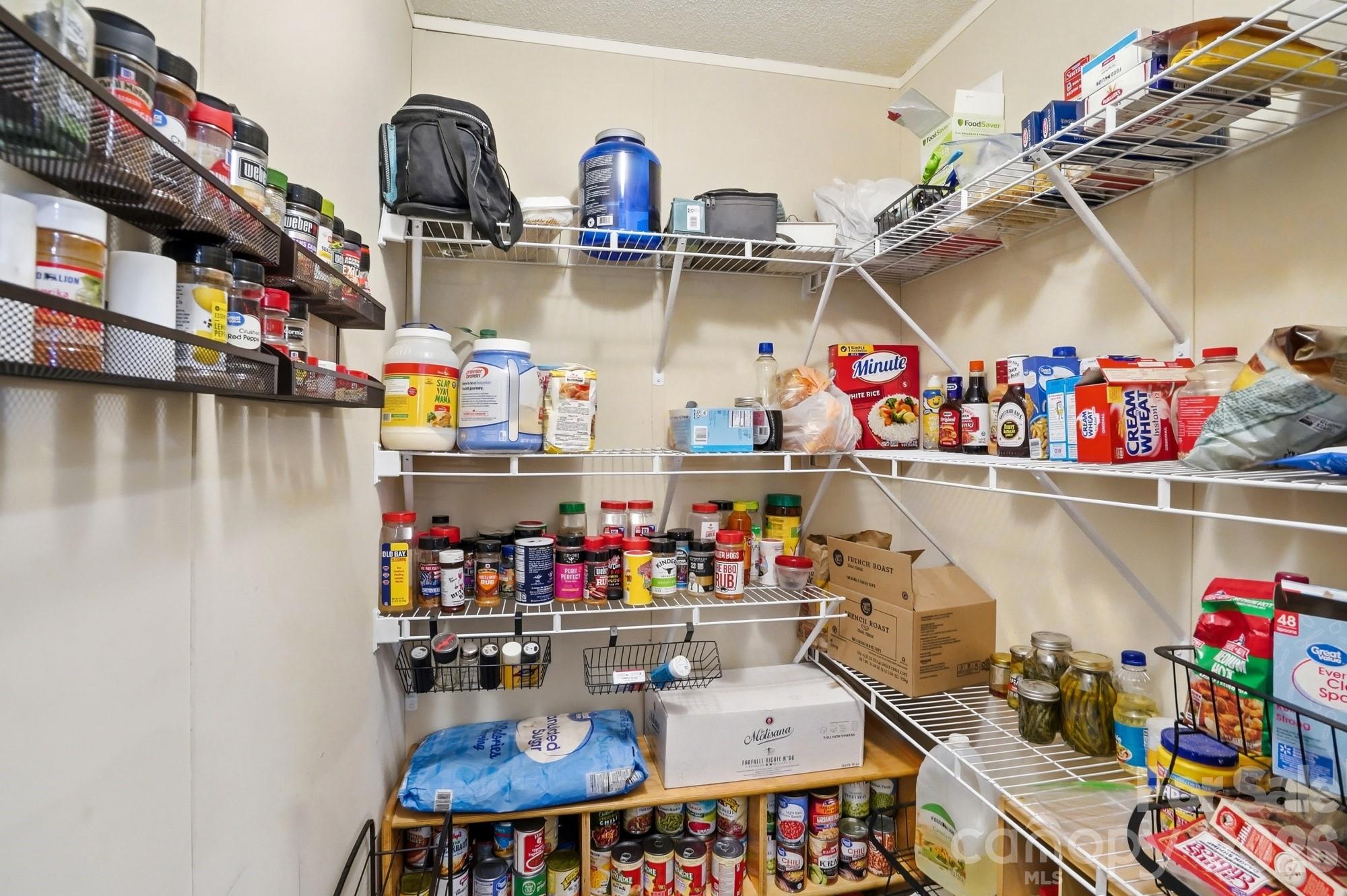 4111 Clontz Taylor Road Marshville, NC 28103 - Photo 10 of 27 a room with lots of clutter and flowers