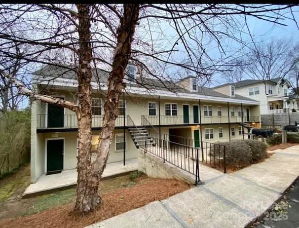 a view of a house with a tree