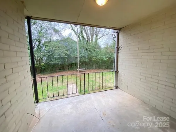 a view of a room with wooden floor and balcony