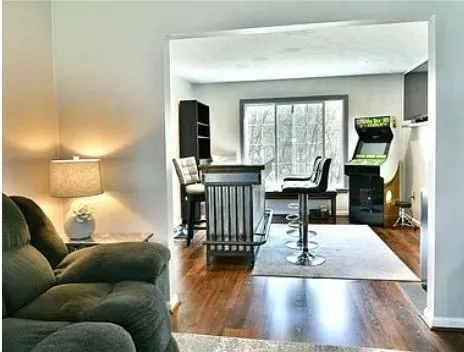 a living room with furniture and a large window