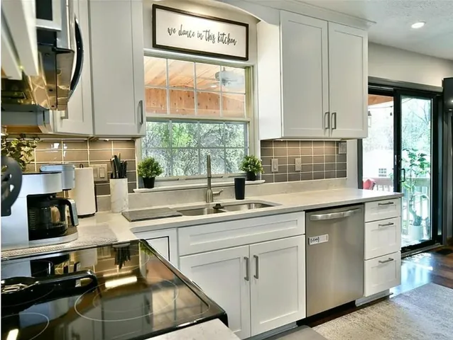 a kitchen with a sink and cabinets