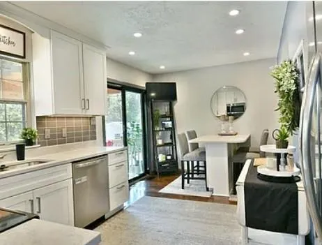 a kitchen with sink and cabinets