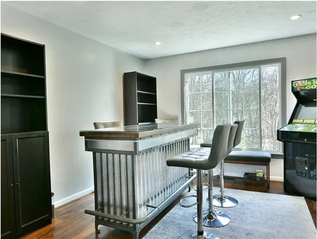 a view of a livingroom with furniture and a window