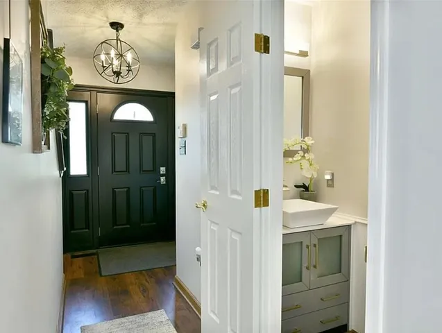 a bathroom with a sink a mirror and a shower