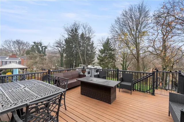 a view of a roof deck with couches and chairs