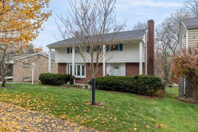 a front view of a house with a yard