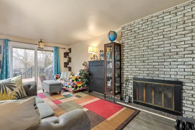 a bedroom with furniture and a fireplace