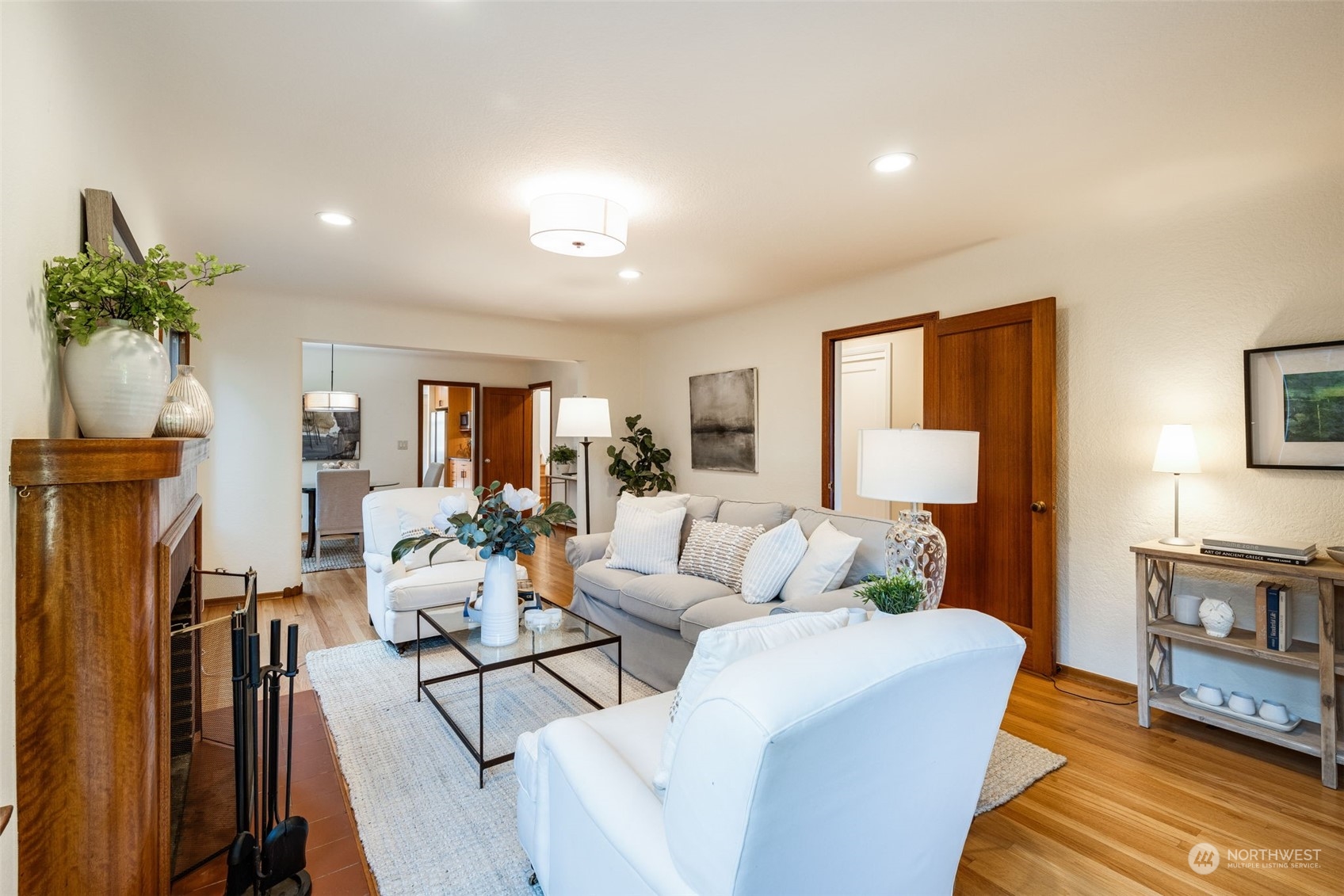 3244 Northwest 59th Street Seattle, WA 98107 - Photo 3 of 40 a living room with furniture a fireplace and a potted plant