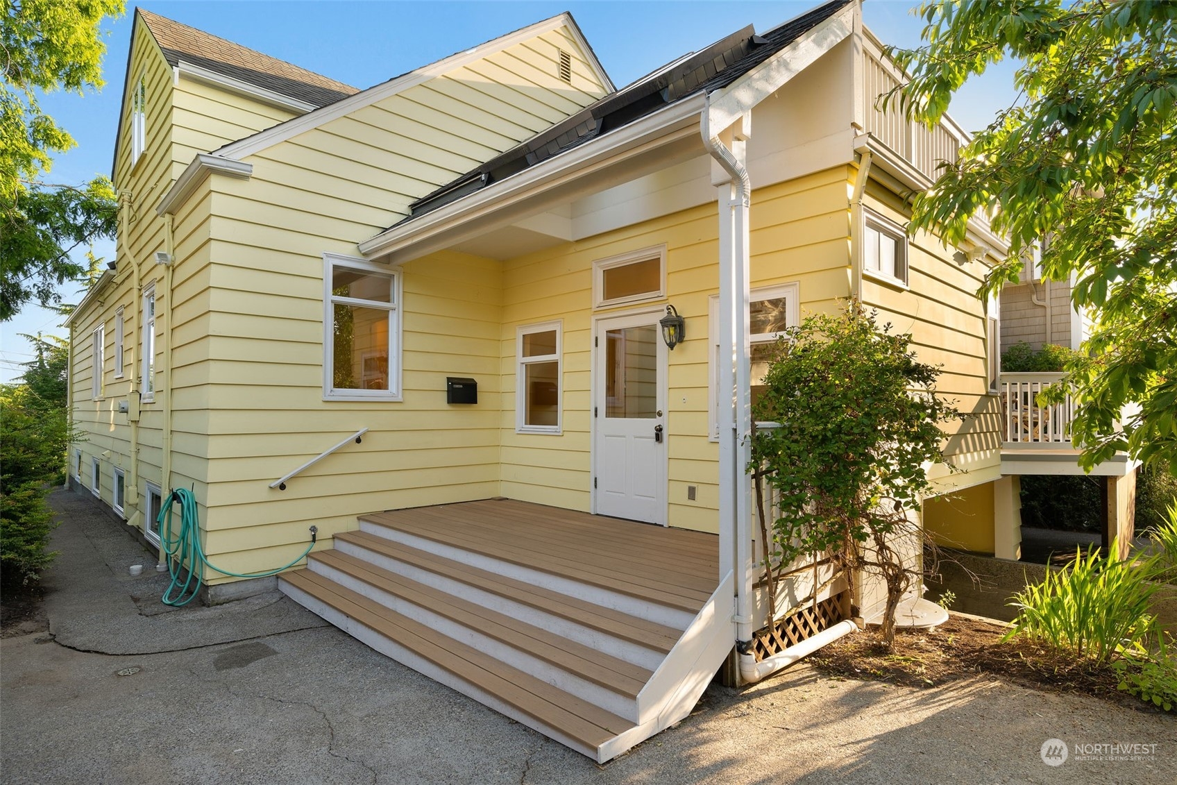 3244 Northwest 59th Street Seattle, WA 98107 - Photo 32 of 40 a view of a house with a window and wooden fence