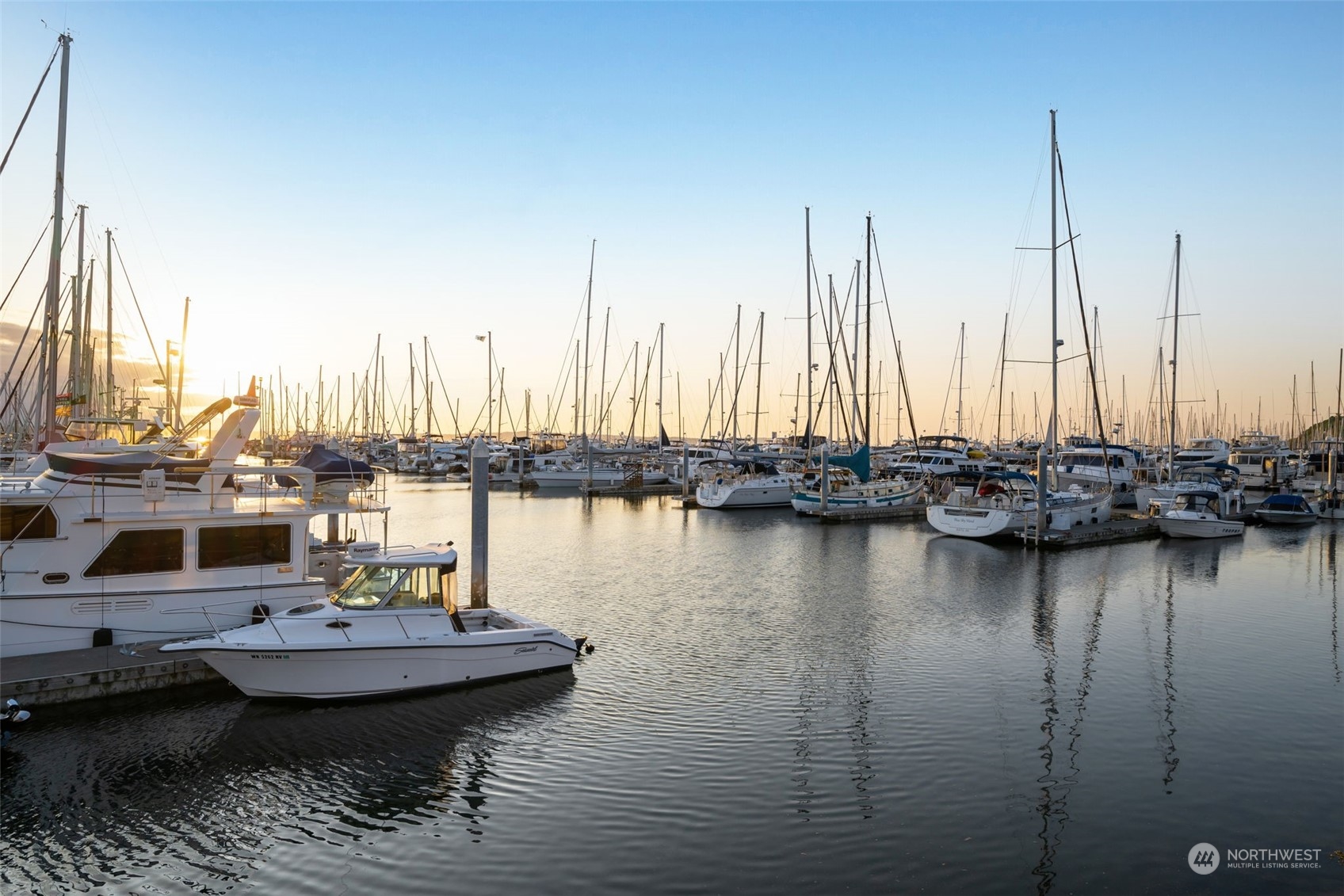 3244 Northwest 59th Street Seattle, WA 98107 - Photo 37 of 40 a view of a lake with boats next to a bridge
