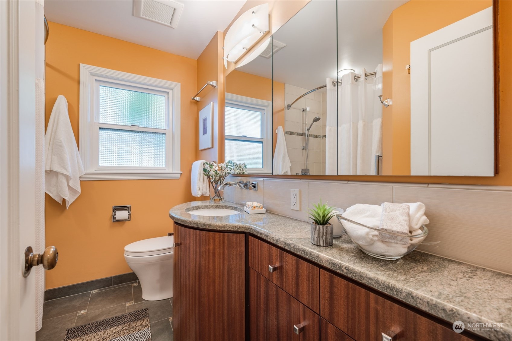 3244 Northwest 59th Street Seattle, WA 98107 - Photo 10 of 40 a bathroom with a granite countertop sink and a mirror