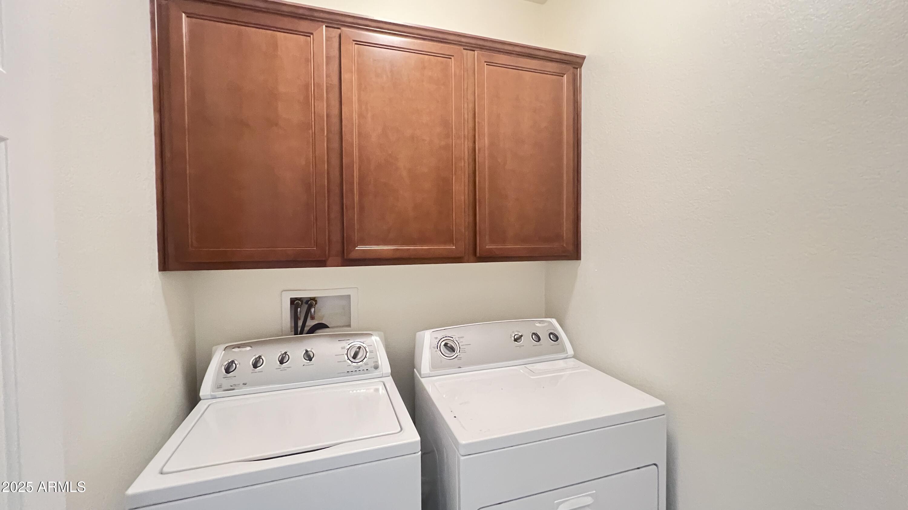 10850 West Avenida Del Rey Peoria, AZ 85383 - Photo 26 of 35 LAUNDRY ROOM WITH BUILT IN CABINETS