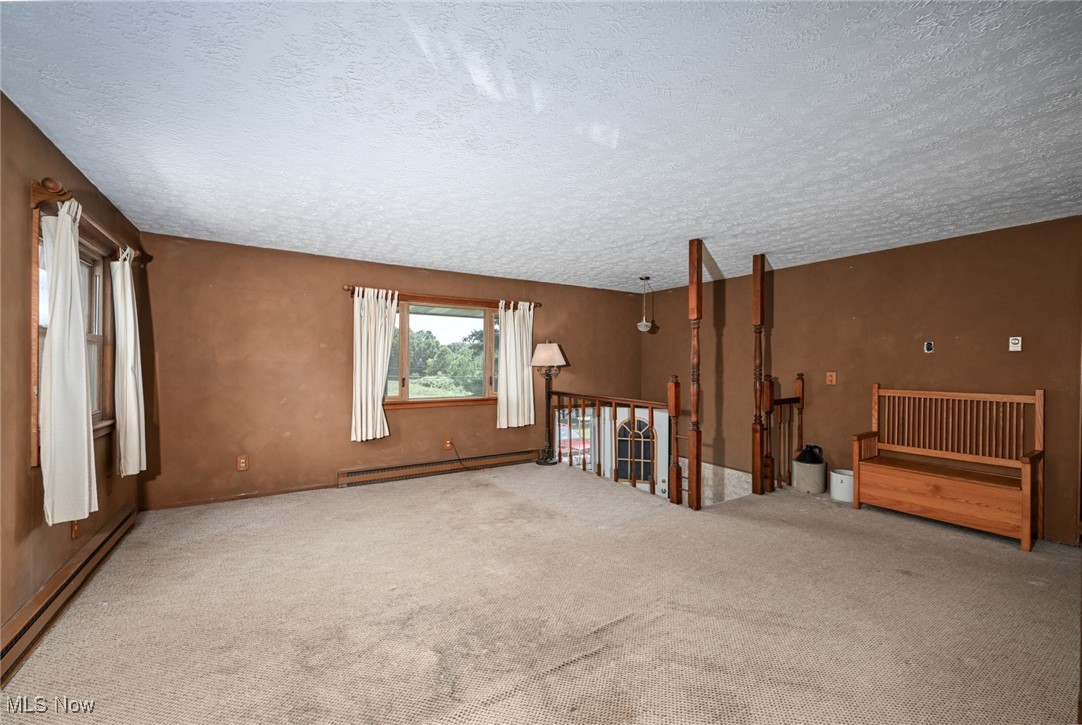 3079 Stroup Road Atwater, OH 44201 - Photo 14 of 40 Welcome to 3079 Stroup Rd, Atwater, OH 44201-9105 - The large living room has plenty of natural light.