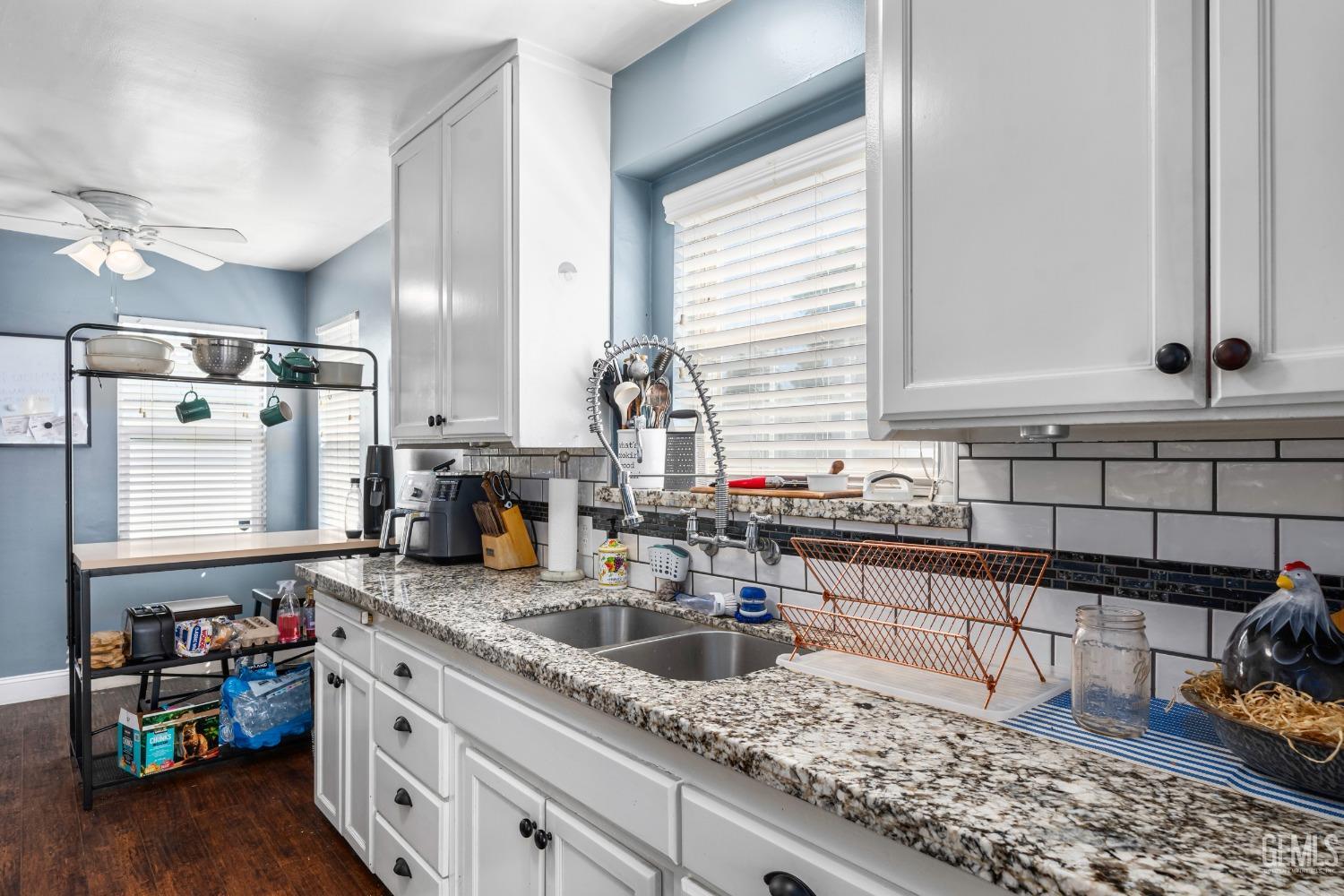 Undisclosed Address Bakersfield, CA 93304 - Photo 12 of 31 a kitchen with sink and cabinets