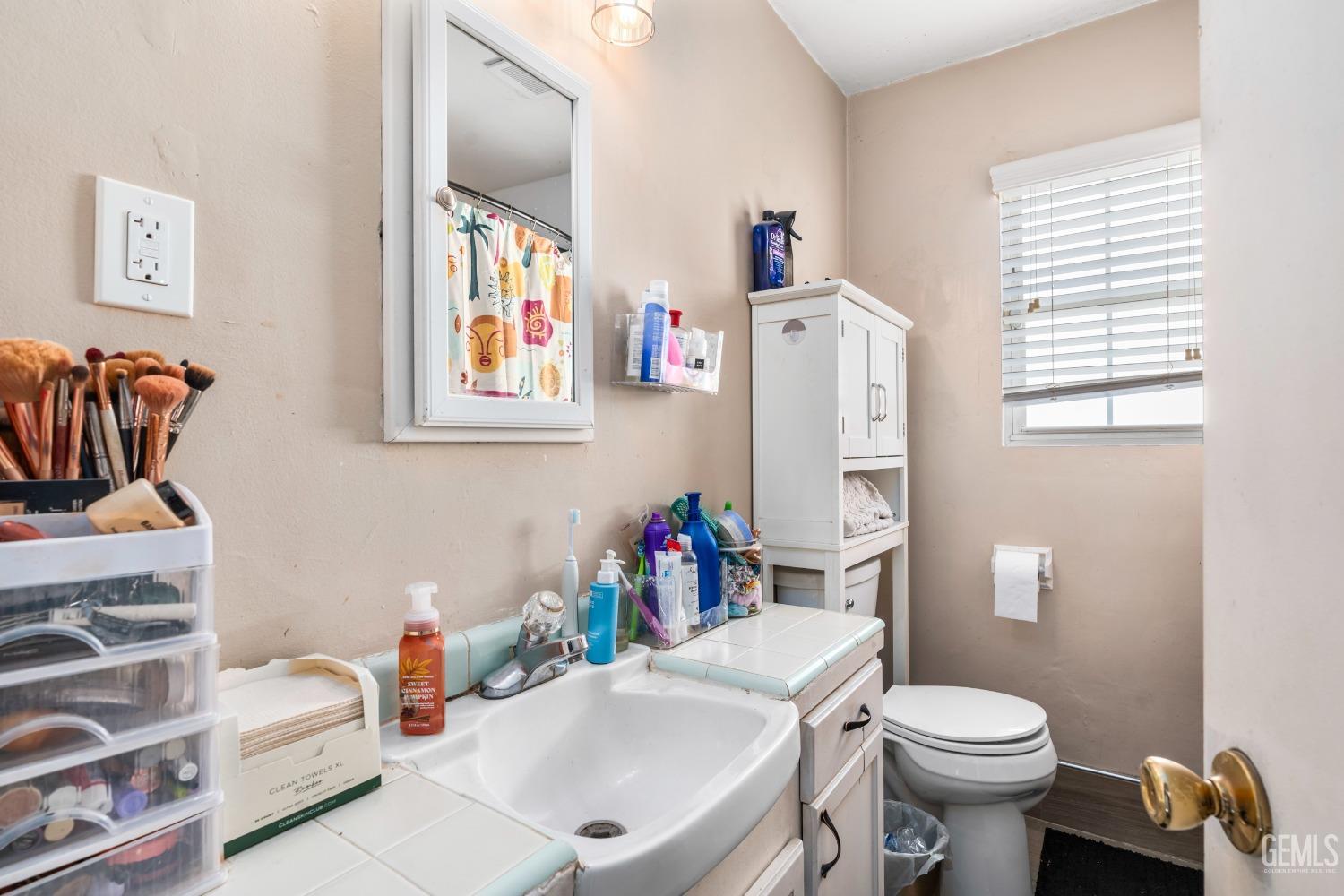 Undisclosed Address Bakersfield, CA 93304 - Photo 18 of 31 a white bath tub sitting next to a white toilet and sink