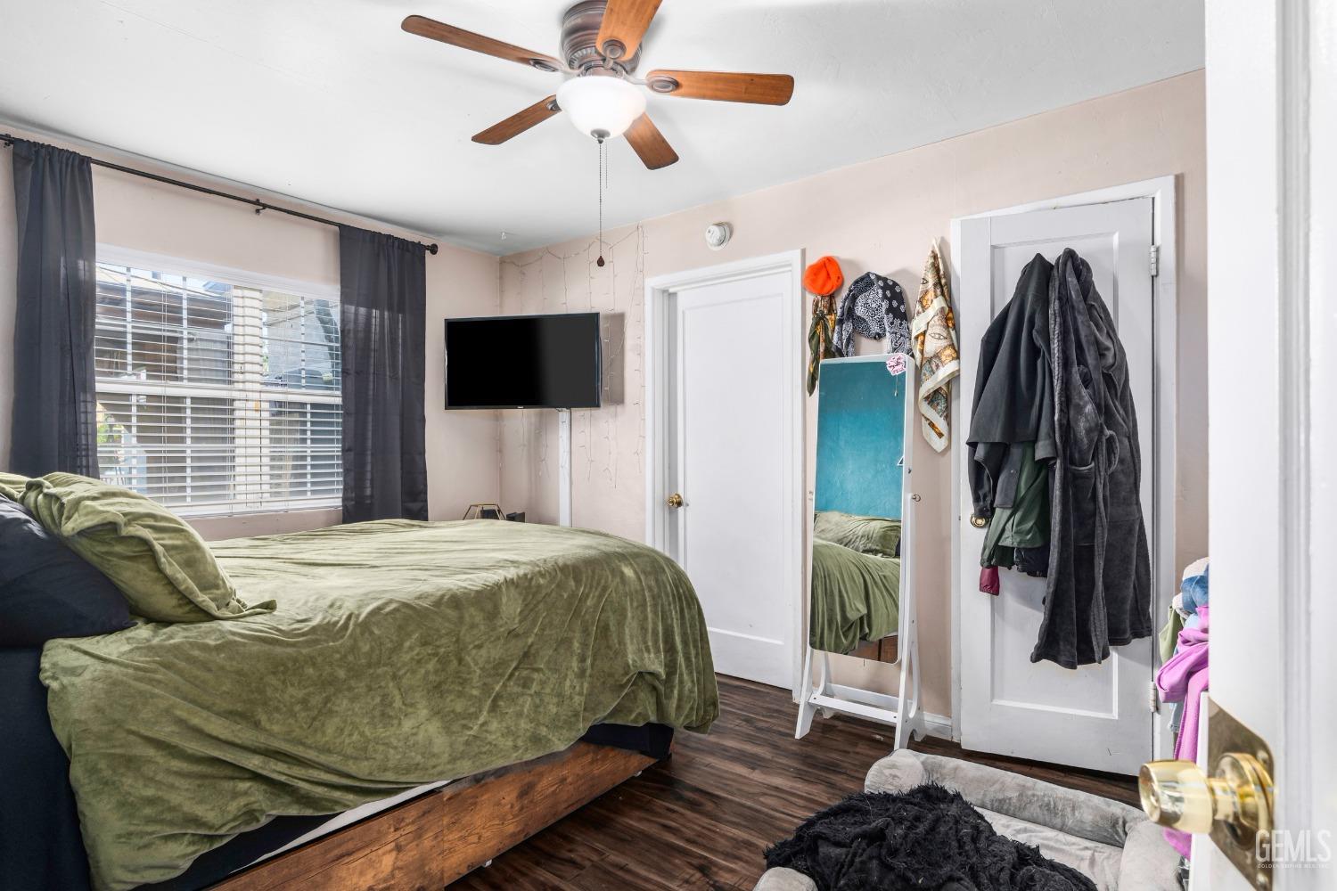 Undisclosed Address Bakersfield, CA 93304 - Photo 19 of 31 a bedroom with a bed and a window