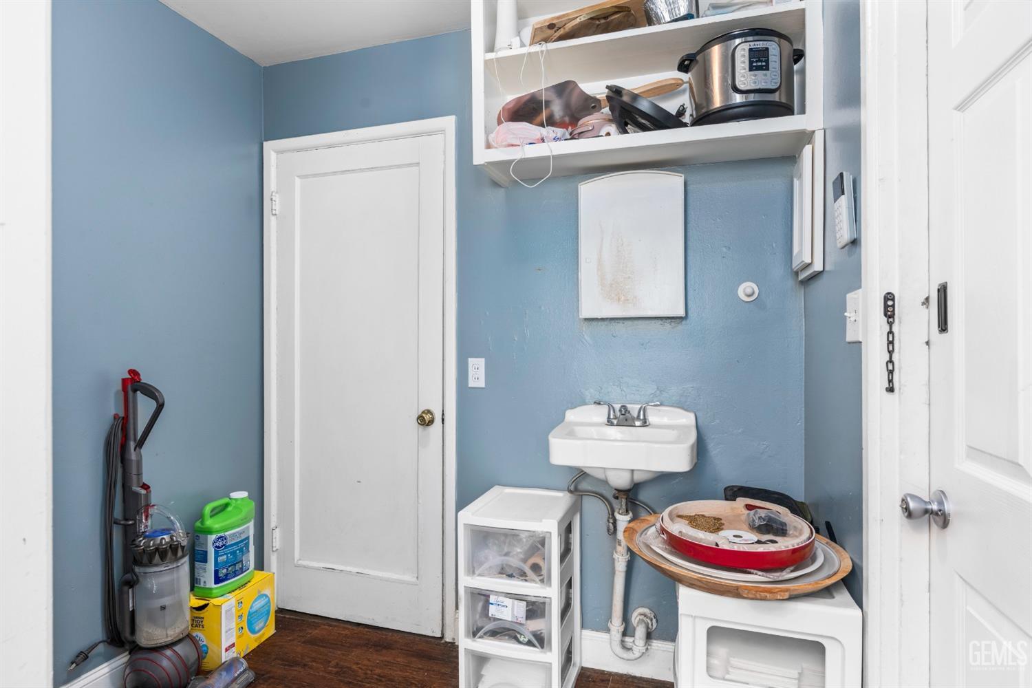 Undisclosed Address Bakersfield, CA 93304 - Photo 21 of 31 a room with furniture and wooden floor